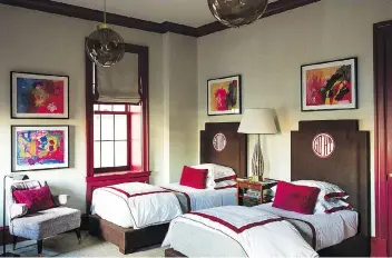  ??  ?? A bedroom for boys by designer Steven Gambrel and architect Martin Sosa has dramatic trim painted in Pratt & Lambert’s Garnet. Gambrel likes to choose a deep-toned accent colour — plucked from another element, such as an accessory or a fabric — for the...