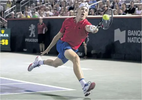  ?? PAUL CHIASSON/THE CANADIAN PRESS ?? Denis Shapovalov hits a return to Rafael Nadal during the Canadian teen’s 3-6, 6-4, 7-6(4) upset victory Thursday night at the Rogers Cup in Montreal.