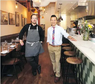  ?? JIM WELLS ?? Jason Barton-Browne, left, and James Hoan Nguyen’s restaurant, Hayloft, is modern and forward-looking but it remains rooted in the farming history of Airdrie.