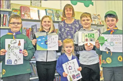  ??  ?? Sapcote Community Library chairman Lorraine Jackson, centre, with from left, Kristian Burbage, Annabelle Coates, Maisie Burbage, Alfie Stallard and Alexander Neilson showing the posters they designed for a library-led competitio­n