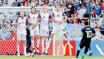  ?? AP/PTI ?? Lionel Messi, right, kicks the ball towards Iceland’s goal during the group D match between Argentina and Iceland at the 2018 soccer World Cup in the Spartak Stadium in Moscow, Russia on Saturday