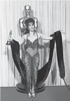  ?? LENNOX MCLENDON/AP ?? Cher was bold in her Bob Mackie gown in 1988.