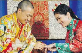  ??  ?? Sakyong Mipham Rinpoche, left, places a ring on his bride Princess Tseyang Palmo’s finger during their Tibetan Buddhist royal wedding ceremony in Halifax in 2006. Mipham, leader of the Shambhala Internatio­nal community, stepped back from his duties...