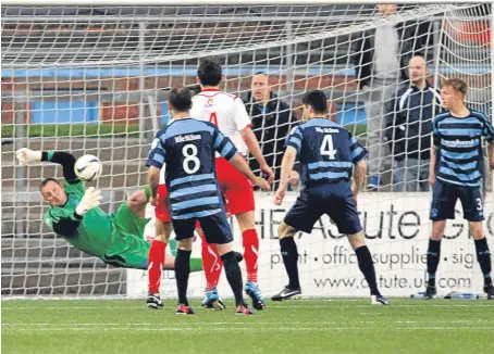  ?? Picture: Kris Miller. ?? Rab Douglas helps Forfar take a three-goal advantage into the play-off second leg.