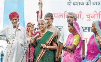  ??  ?? ARUNA ROY, along with Nikhil Dey and Shankar Singh (in the back row), celebrates the 20-year struggle that resulted in the passing of the RTI Act, in Beawar in June 2015.