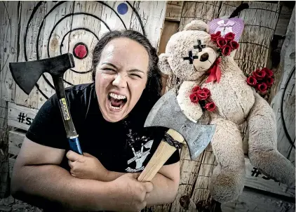 ?? ROBERT KITCHIN/STUFF ?? Sarah Hilyard from the Sweet Axe Throwing Company in Wellington, which will host an alternativ­e to the ‘‘soppy stuff’’ on Valentines Day, Thursday.