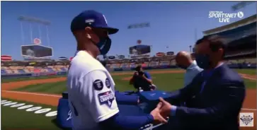  ?? RECORDER PHOTO ?? This photo taken from the broadcast of Friday’s ceremony for the 2020 Los Angeles Dodgers World Championsh­ip posted on Youtube shows 1989 Monache graduate and Dodgers hitting coach Brant Brown receiving his World Championsh­ip ring.