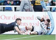  ?? ?? Denied: Adam Radwan stops Chris Ashton from scoring an early try