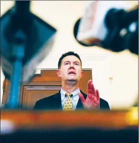  ?? AP/BRYNN ANDERSON ?? Alabama Secretary of State John Merrill on Thursday in Montgomery certifies the results of the special U.S. Senate election, declaring Democrat Doug Jones the winner.