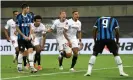  ??  ?? Romelu Lukaku (right) stands with his head bowed after deflecting a bicycle kick by Diego Carlos (second right) into Inter’s net. Photograph: Lars Baron/Getty Images