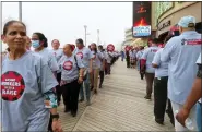  ?? WAYNE PARRY - THE ASSOCIATED PRESS ?? Members of Local 54of the Unite Here casino workers union picket outside the Tropicana casino in Atlantic City, N.J., on June 1. On June 24, the union issued a report estimating that four casinos including the Tropicana could lose $2.6million a day in the event of a strike, which has been threatened for July 1if a new contract is not reached by then.