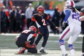  ?? GARY LANDERS — THE ASSOCIATED PRESS ?? Bengals kicker Mike Nugent (2) misses an extra point attempt in the first half Sunday against the Buffalo Bills, in Cincinnati. The Bills won 16-12.