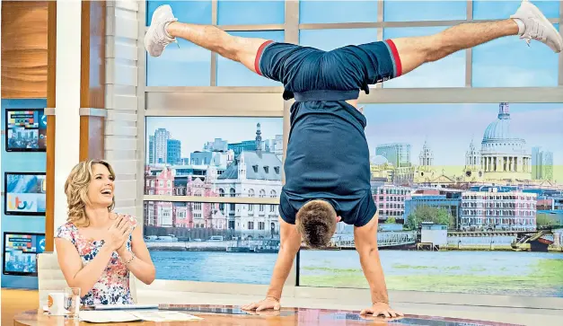  ??  ?? Max Whitlock shows off his skills to Charlotte Hawkins of ITV’s Good Morning Britain