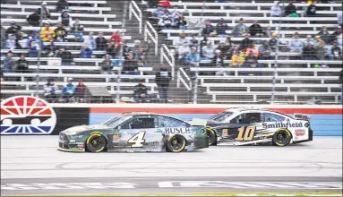  ?? Larry Papke / Associated Press ?? Kevin Harvick (4) and Aric Almirola (10) battle for position during a Nov. 3 NASCAR Cup Series race at Texas Motor Speedway, in Fort Worth, Texas. The massive grandstand­s at TMS stretch about two-thirds of a mile long, and were empty for the last race there. There could still be some feeling of emptiness Sunday, preferable for social distancing, even when the NASCAR Cup Series race becomes the first major sporting event in Texas in more than four months to allow spectators. It will be one of the largest gatherings of any kind in the state since the start of the coronaviru­s pandemic.