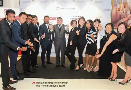  ??  ?? Proton Edar CEO Rohime Shafie receiving the award for Best Compact won by Proton Persona (Premium CVT) from Lee. Roslan (centre) rejoicing with the Honda Malaysia team.