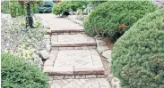  ?? MARKCULLEN.COM PHOTOS ?? Random flagstone is making a comeback in garden path designs. Right, inlaid-brick patterns add geometrica­l structure.