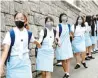  ?? AP-Yonhap ?? Students form human chain outside the Maryknoll Convent School in Hong Kong, Friday.