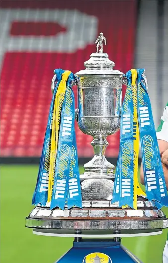  ??  ?? Celtic captain Scott Brown, above, with the William Hill Scottish Cup at Hampden yesterday as he previewed today’s showpiece game. Brown has admitted that former manager Brendan Rodgers – pictured right handing the Scottish League Cup to Brown after beating Motherwell in the 2017-18 final – helped change the mindset at the club after his arrival three years ago.