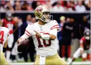  ?? AP PHOTO BY DAVID J. PHILLIP ?? San Francisco 49ers quarterbac­k Jimmy Garoppolo (10) throws against the Houston Texans during the first half of an NFL football game Sunday in Houston.