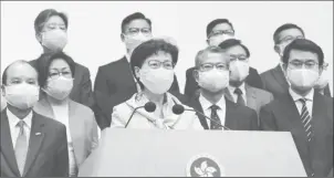  ??  ?? FILE PHOTO: Hong Kong Chief Executive Carrie Lam, wearing a face mask following the coronaviru­s disease (COVID-19) outbreak, attends a news conference with officers over Beijing’s plans to impose national security legislatio­n in Hong Kong, China May 22, 2020. REUTERS/Tyrone Siu