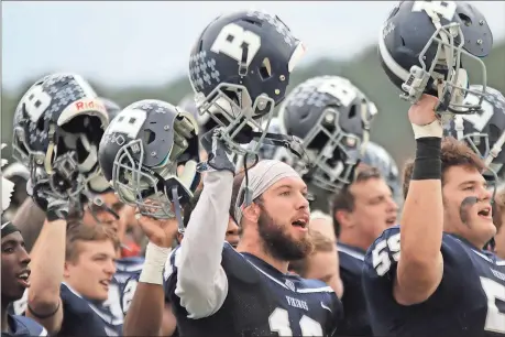  ??  ?? File, Jeremy Stewart / RN-T
Berry defensive back Jackson Putnam (center) sings the school’s alma mater along with his teammates following the Vikings’ 34-20 win over Huntingdon in an NCAA Division III playoff game at Valhalla. The Vikings are in...