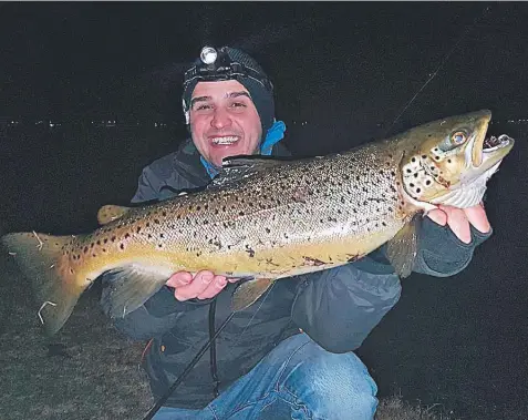  ??  ?? Nick Vasiljevic with the 3.55kg brown trout he caught from Lake Wendouree at Ballarat.