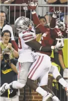  ?? Billy Hefton / Enid (Okla.) News & Eagle ?? On Saturday, Ohio State’s Noah Brown caught a touchdown pass behind Oklahoma’s Michiah Quick.