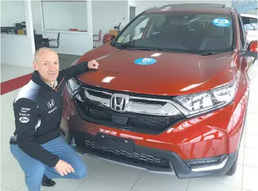  ??  ?? George Tambassis with the new Honda CR-V now at warragul City Motors.