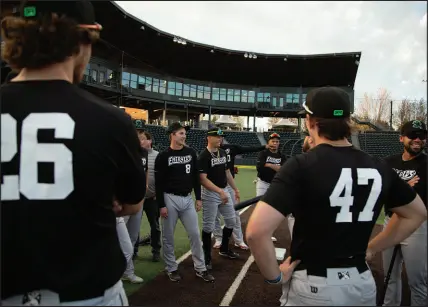  ?? ?? Eugene Emeralds players get ready for their first practice of the season at PK Park. MLB guidelines have added requiremen­ts that make fixing up old stadiums out of the price range, leaving clubs in limbo.