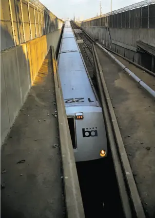  ?? Scott Strazzante / The Chronicle ?? A BART train in Oakland heads to the Transbay Tube, where passengers are often stuck during delays on increasing­ly crowded trains.