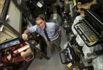  ?? Ruth Fremson/The New York Times ?? Peter V. Tytell is surrounded by typewriter­s at his office in Manhattan in 2001. Mr. Tytell — whose knowledge of the intricacie­s of typewriter­s, shaped during his youth at his parents’ renowned repair shop in New York, led him to a career as a forensic document examiner and even a small part in the 2004 presidenti­al campaign — died on Aug. 11 at his home in Manhattan. He was 74.