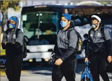  ?? KARL MONDON — STAFF PHOTOGRAPH­ER ?? San Jose State football players return home from Idaho on Saturday after the cancellati­on of a highly-anticipate­d game against Boise State.