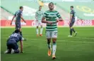  ?? Photograph: Jane Barlow/PA ?? Celtic winger Mohamed Elyounouss­i celebrates after scoring his side’s third goal.