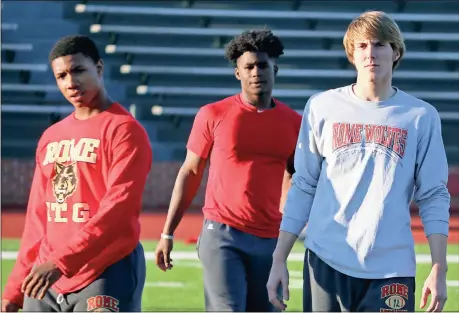  ?? Jeremy Stewart / RN-T ?? Rome High players Marquez Kirby (from left), Jamious Griffin and Knox Kadum get instructio­ns during practice Thursday at Barron Stadium. The Wolves will face Warner Robins on the road for the Class 5A state championsh­ip tonight at 7:30 p.m.