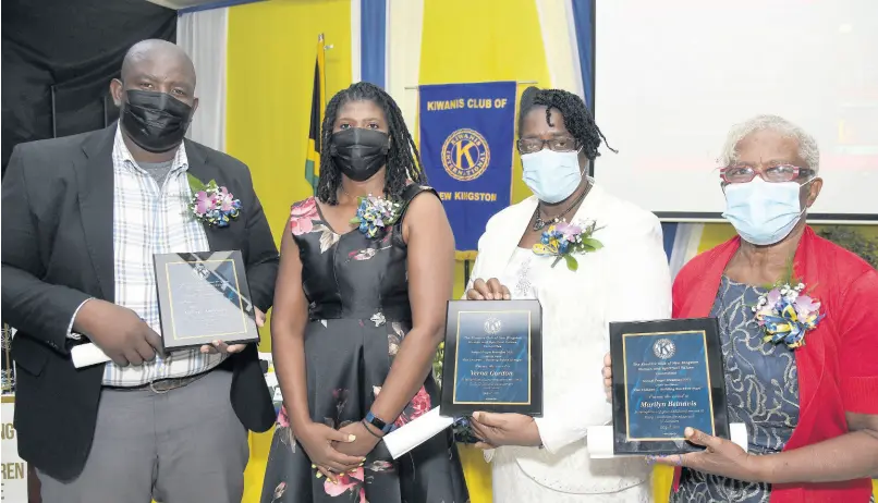  ?? IAN ALLEN/PHOTOGRAPH­ER ?? Suzilee McLean-Chambers (second left) president, Kiwanis Club of New Kingston, with awardees from the early- childhood education sector at the club’s prayer breakfast on Saturday morning. From left are Meikle Anderson, who collected the award on behalf of his mother Valerie Anderson, principal of Faith Builders Early Childhood Centre; Verna Gordon, principal, Elim Early Childhood Developmen­t Centre; and Marilyn Belnavis, principal, Roehampton Basic School.