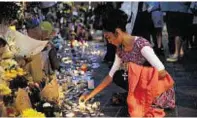  ??  ?? People lit candles and left tributes at Notting Hill Methodist Church near Grenfell Tower