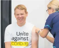  ?? Photo / Mark Mitchell ?? Covid-19 Response Minister Chris Hipkins received his first dose of the Pfizer vaccine at Ropata Health in Lower Hutt.