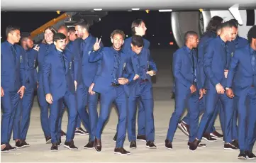  ??  ?? Brazil’s forward Neymar (centre) gestures upon the team’s landing at Sochi airport, in Russia on June 11, 2018, ahead of the FIFA World Cup. — AFP photo