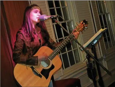  ?? PHOTOS SPECIAL TO THE DISPATCH BY MIKE JAQUAYS ?? Cait Devin performs an acoustic set of originals and covers during the most recent Local Music Project showcase March 6 at the Colgate Inn in Hamilton. Shows will continue on alternatin­g Tuesdays though May 15.