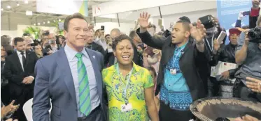  ?? Photo: DEPTFO News ?? Fiji Police officer Titilia Koroitacin­a dancing with Arnold Shwarzeneg­ger at the Fijian Pavilion in Bonn, Germany.