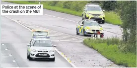  ??  ?? Police at the scene of the crash on the M61