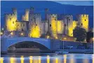  ??  ?? TRIBUTE Conwy Castle is lit in yellow