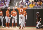  ?? Matt Kelley / Associated Press ?? Texas’ Ivan Melendez (17) has hit 32 homers this year, the most in Division I since 2003.