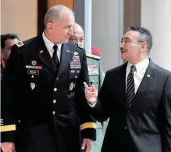  ??  ?? Hishammudd­in accompanyi­ng United States Army Pacific commander Gen Robert B. Brown to the opening ceremony of the seminar.