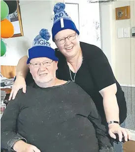  ??  ?? Wearing the trademark “Big Freeze” beanies that have become a major fundraiser for the Motor Neuron Disease Foundation are former Coles Warragul staff member Rob Wilson and his wife Tina.