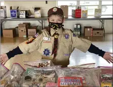  ?? SUBMITTED PHOTO ?? Birdsboro Pack 595 Cub Scout Declan Larrimore, 10, Bally, put together Sunshine Bags. He saved his own money to purchase items to donate to the elderly. Each bag includes a puzzle book, pens, snacks, tissues, bath bombs, and a book of inspiratio­nal quotes. “I hope they’re very happy to get the fun things that were in them.”