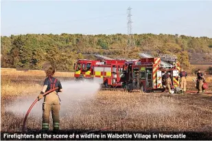  ?? ?? Firefighte­rs at the scene of a wildfire in Walbottle Village in Newcastle