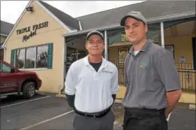  ?? PETE BANNAN-DIGITAL FIRST MEDIA ?? Jim Petro Jr. and Jim Petro III at their store, Triple Fresh on Doe Run Road in East Fallowfiel­d. They are celebratin­g their 30th anniversar­y.