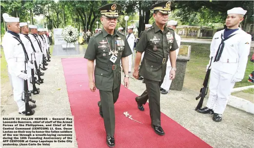  ??  ?? SALUTE TO FALLEN HEROES – General Rey Leonardo Guerrero, chief of staff of the Armed Forces of the Philippine­s, and Chief of the Central Command (CENTCOM) Lt. Gen. Oscar Lactao on their way to honor the fallen soldiers of the war through a...