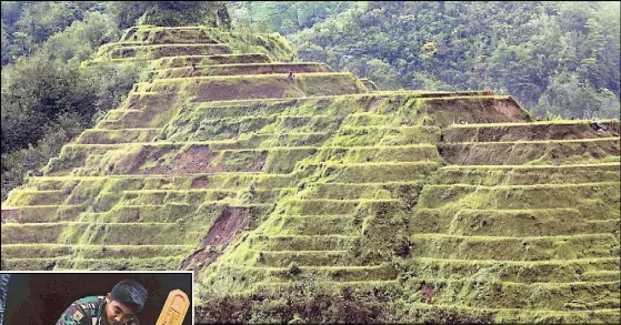  ?? EPA-EFE ?? Photo shows the Banaue Rice Terraces, a World Heritage Site, after being damaged by Typhoon Rosita in Ifugao yesterday. Inset shows soldiers loading equipment to rescue people still trapped in a building buried by a landslide in Natonin, Mountain Province.